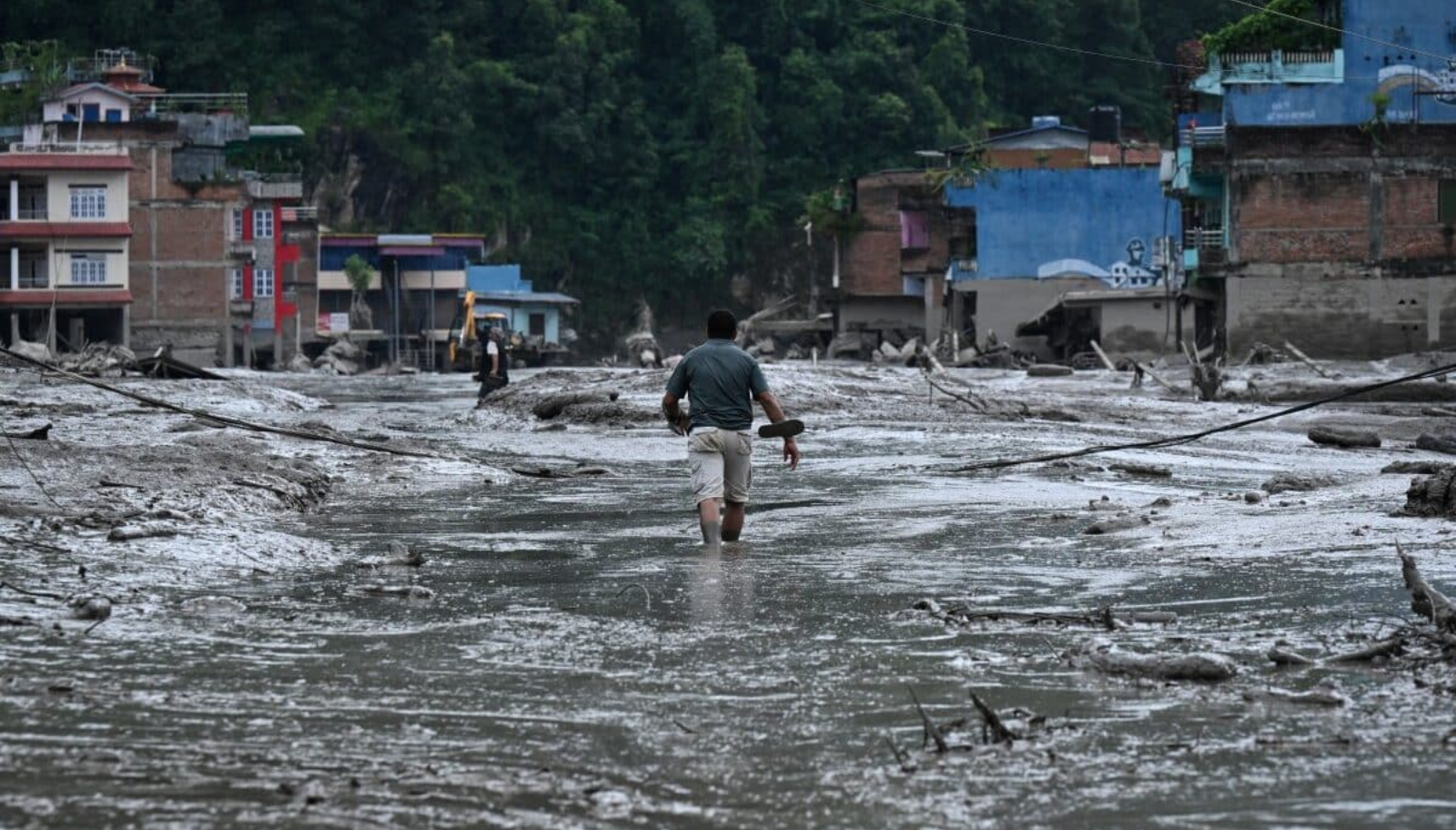 How far from or close to is Bangladesh from Nepal in terms of environmental disaster?